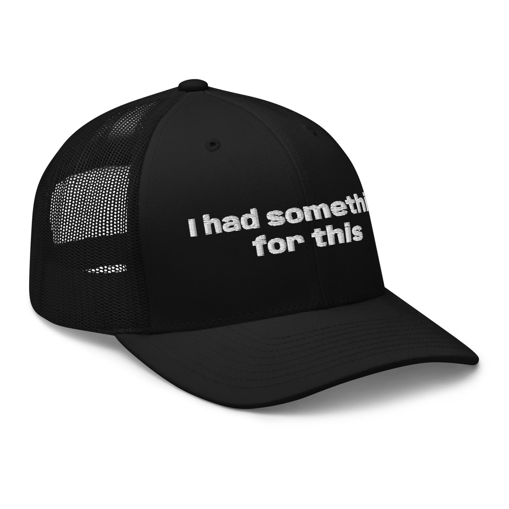Black trucker hat with embroidered text reading “I had something for this.” Frankie Said Meow