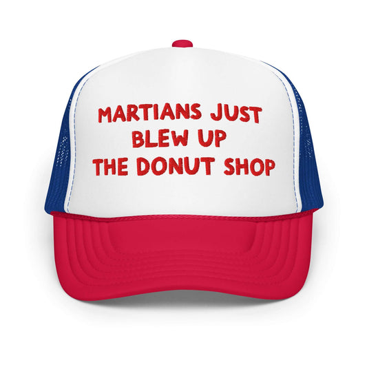 Red, white, and blue trucker hat embroidered with the phrase Martians Just Blew Up the Donut Shop